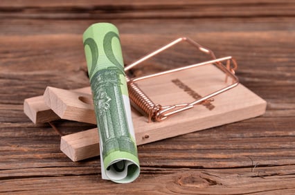 roll of money and a mousetrap